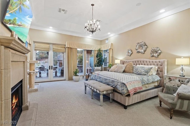 bedroom with a tile fireplace, ornamental molding, light carpet, access to outside, and french doors