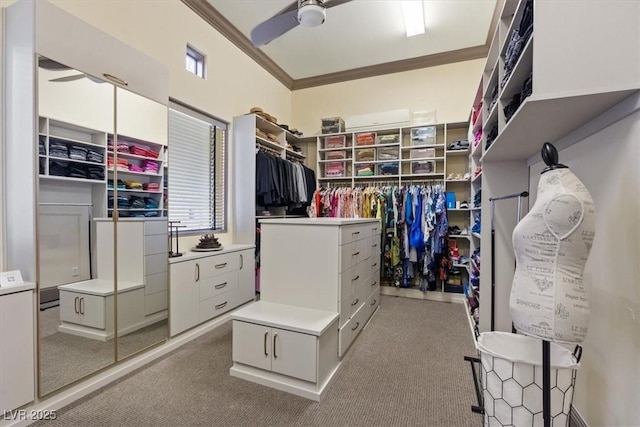 walk in closet with light carpet and ceiling fan