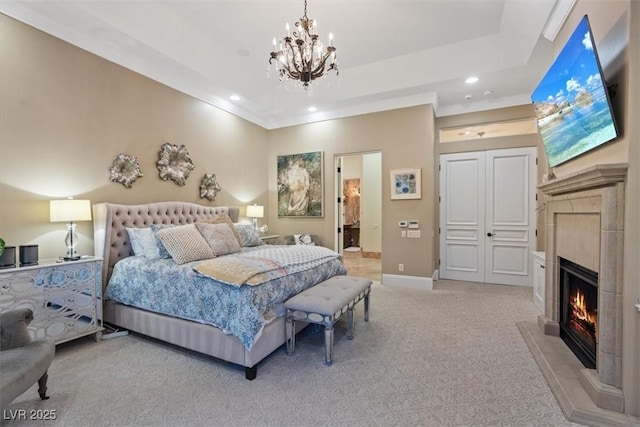 carpeted bedroom with a tray ceiling