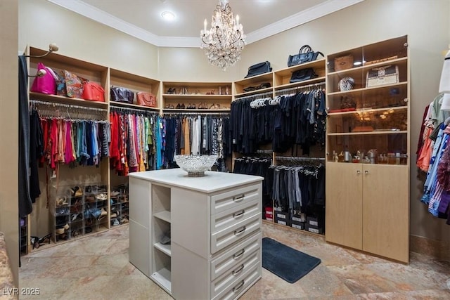 spacious closet featuring a notable chandelier