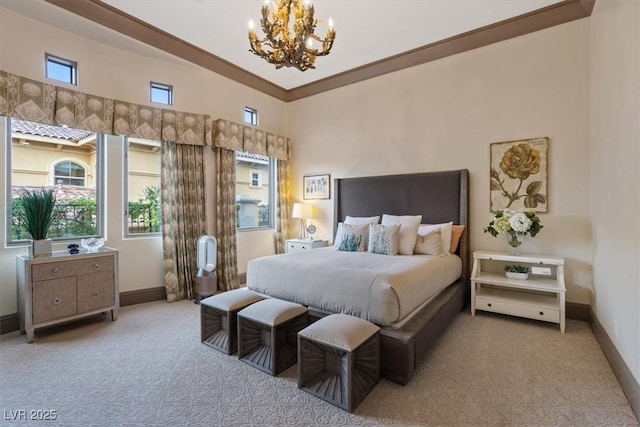 bedroom featuring an inviting chandelier, ornamental molding, and light carpet