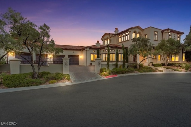 mediterranean / spanish-style home featuring a garage