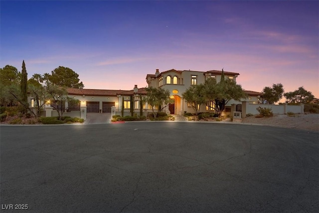 mediterranean / spanish-style home featuring a garage