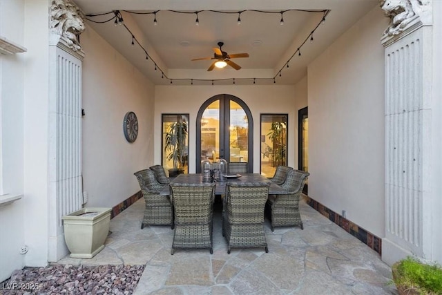 view of patio featuring ceiling fan and french doors