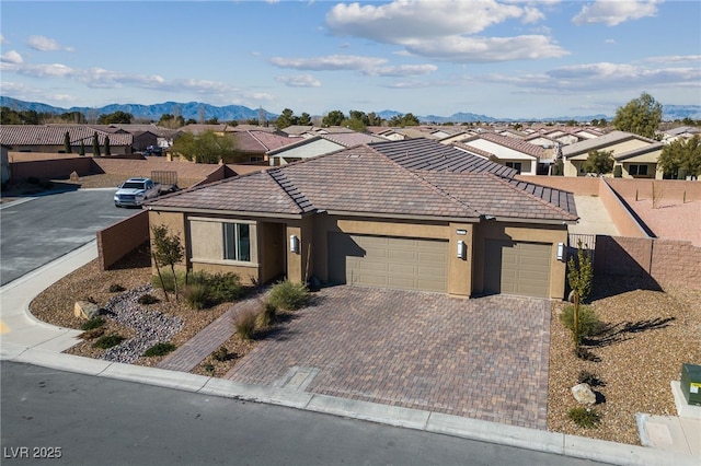 ranch-style house featuring a mountain view and a garage