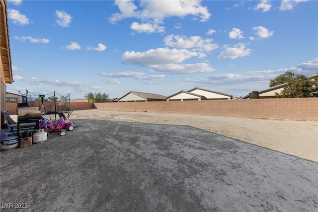 view of yard featuring a trampoline