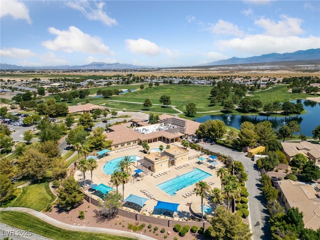 drone / aerial view featuring a water and mountain view