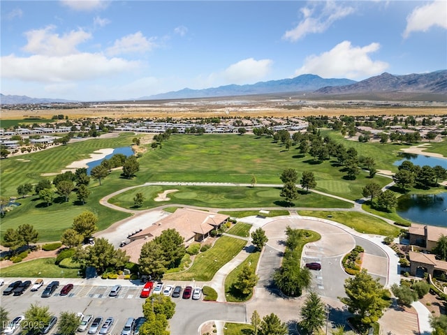 drone / aerial view with a water and mountain view