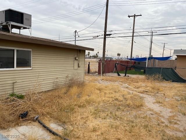 view of yard with central AC unit