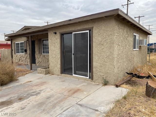 rear view of house featuring a patio