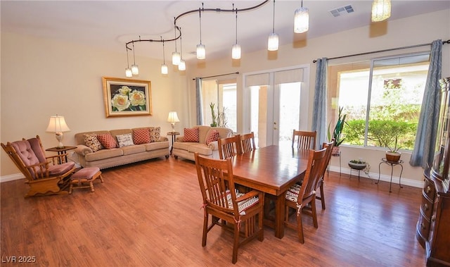 dining room featuring hardwood / wood-style floors and plenty of natural light