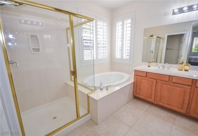 bathroom featuring vanity, tile patterned floors, and shower with separate bathtub