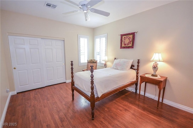 bedroom featuring dark hardwood / wood-style flooring, a closet, and ceiling fan