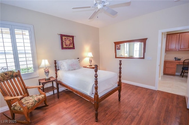 bedroom with dark hardwood / wood-style floors