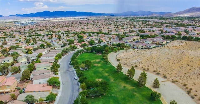 birds eye view of property featuring a mountain view