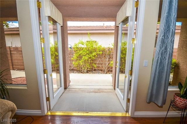 doorway to outside featuring wood-type flooring