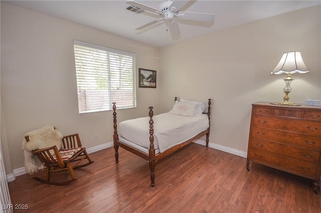 bedroom featuring dark hardwood / wood-style floors and ceiling fan