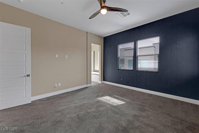 spare room featuring carpet floors and ceiling fan