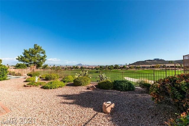 view of yard featuring a mountain view and a rural view