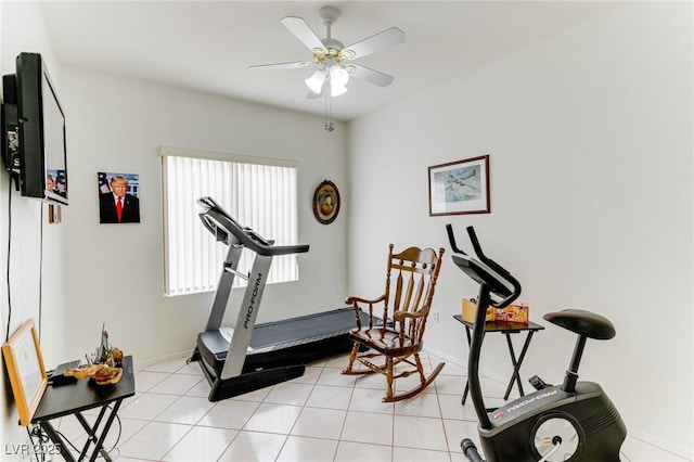 exercise area with light tile patterned flooring and ceiling fan