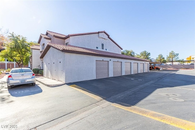 view of property exterior with a garage