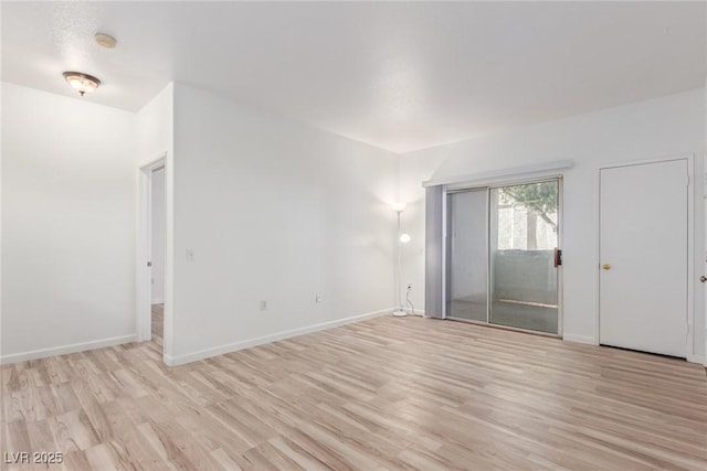 spare room with light hardwood / wood-style floors