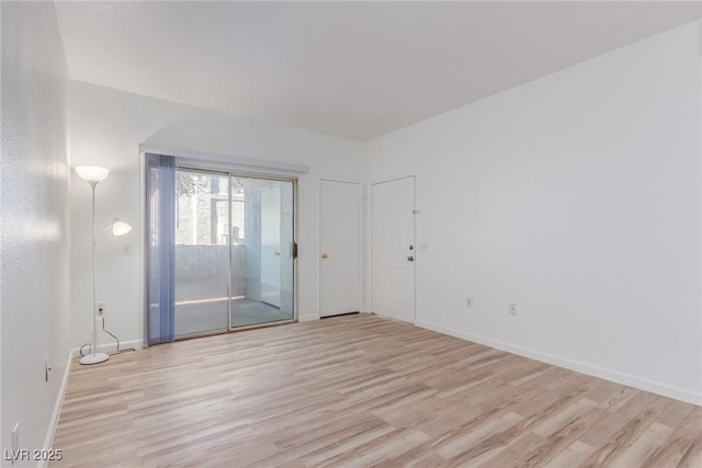 unfurnished room with light hardwood / wood-style floors