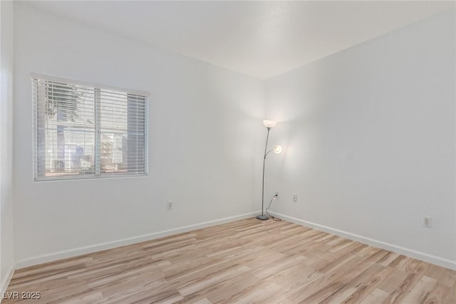 spare room featuring light hardwood / wood-style floors