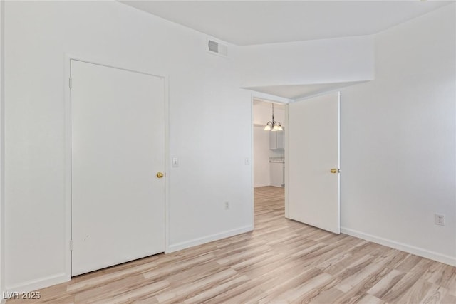 unfurnished bedroom with light hardwood / wood-style flooring