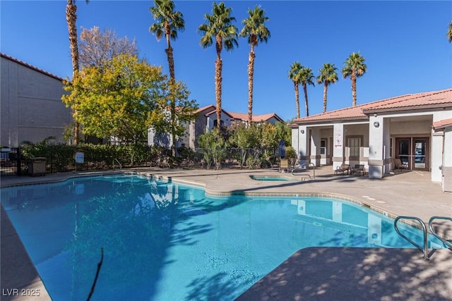 view of swimming pool with a patio