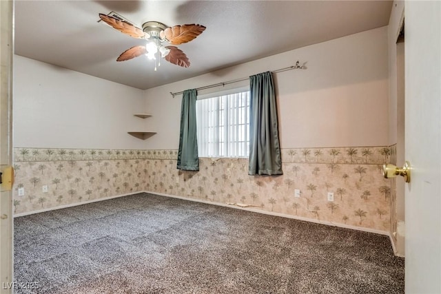 spare room featuring carpet flooring and ceiling fan