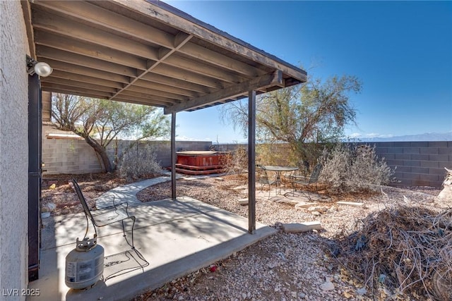 view of patio with a hot tub