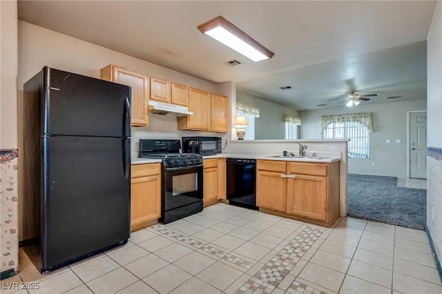 kitchen featuring sink, light tile patterned floors, ceiling fan, black appliances, and kitchen peninsula