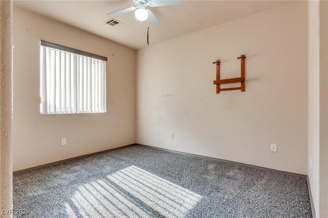 empty room featuring ceiling fan and carpet flooring