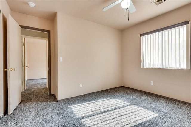 carpeted empty room with ceiling fan