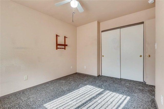 unfurnished bedroom with carpet floors, a closet, and ceiling fan