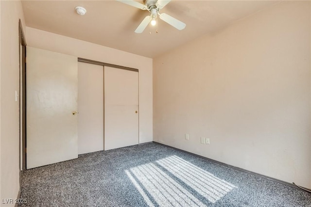 unfurnished bedroom featuring carpet floors, ceiling fan, and a closet