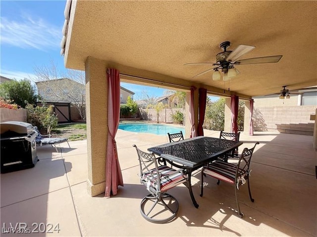 view of patio featuring outdoor dining area, a fenced backyard, ceiling fan, grilling area, and a fenced in pool