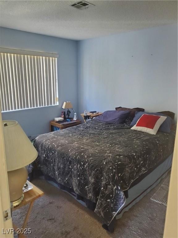 bedroom with a textured ceiling