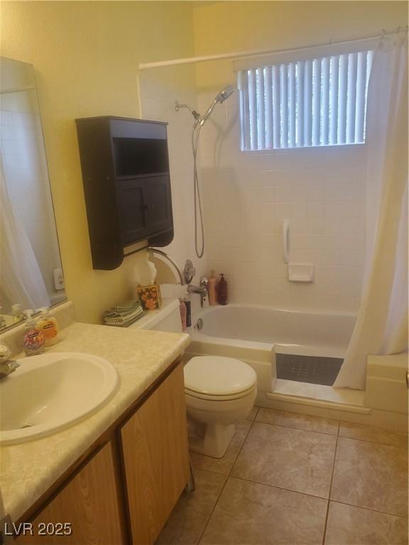 full bathroom with tile patterned flooring, vanity, shower / bathtub combination with curtain, and toilet