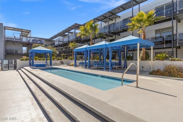 view of swimming pool featuring a patio area