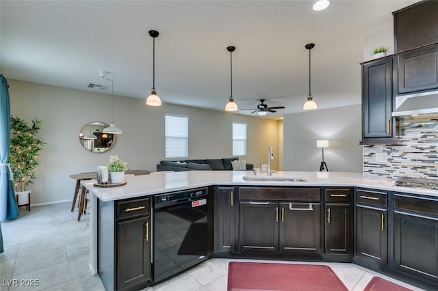 kitchen with sink, hanging light fixtures, kitchen peninsula, dishwasher, and decorative backsplash