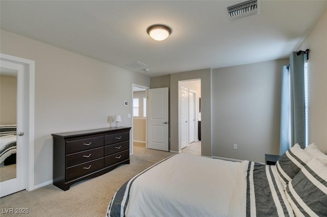 bedroom featuring light carpet