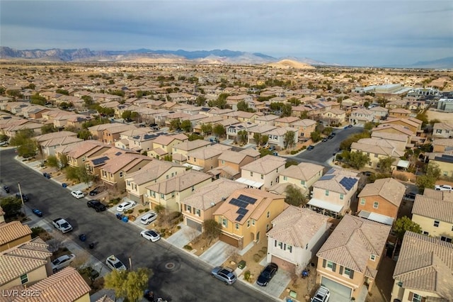 birds eye view of property featuring a mountain view