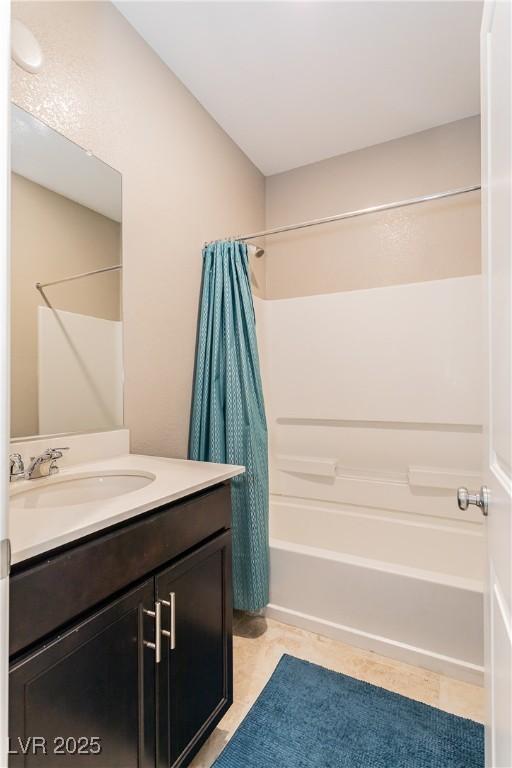 bathroom featuring shower / tub combo, vanity, and tile patterned floors