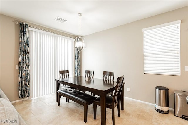 dining room with light tile patterned floors, baseboards, and visible vents