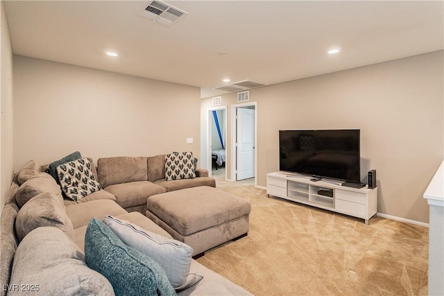 living room with recessed lighting, light colored carpet, and visible vents