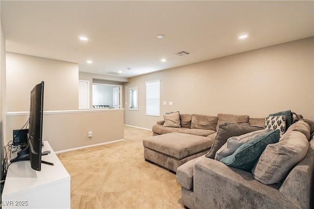 living room with recessed lighting, visible vents, light carpet, and baseboards