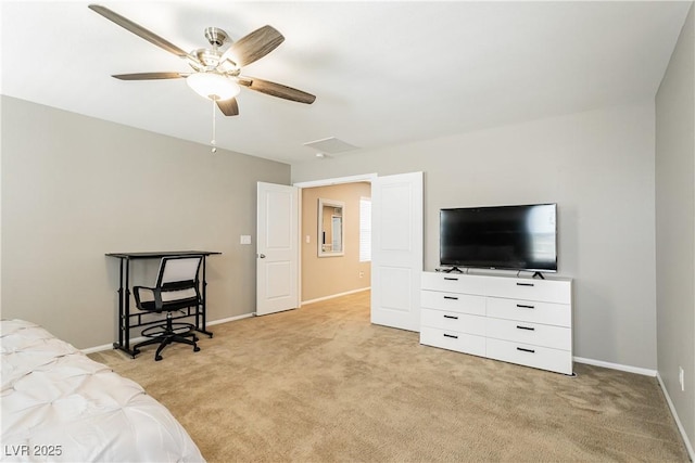 bedroom featuring a ceiling fan, attic access, light colored carpet, and baseboards