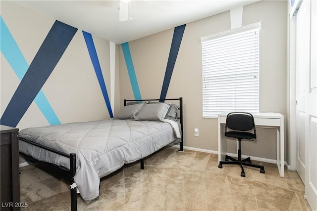 bedroom featuring light carpet, ceiling fan, and baseboards